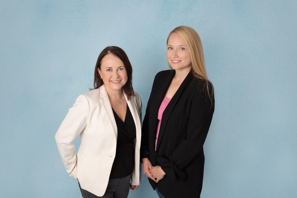 Natasha and Vicki of MMC Research standing smiling